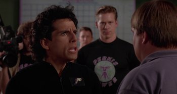 Movie still from “Heavyweights” (1995), directed by Steven Brill – A group of men standing next to each other in a room; Close Up shot, Over the shoulder angle