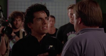 Movie still from “Heavyweights” (1995), directed by Steven Brill – A group of men standing next to each other in a room; Close Up shot, Over the shoulder angle