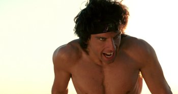 Movie still from “Heavyweights” (1995), directed by Steven Brill – A shirtless man with a headband on his head; Close Up shot, Low angle