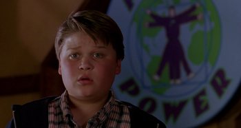 Movie still from “Heavyweights” (1995), directed by Steven Brill – A young boy is looking into the camera; Close Up shot, Low angle