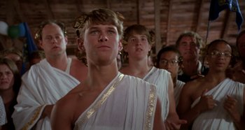 Movie still from “Heavyweights” (1995), directed by Steven Brill – A group of men in ancient roman garb standing together; Close Up shot, Low angle