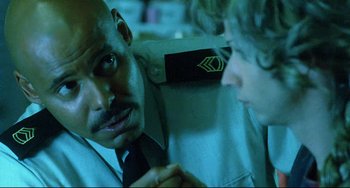 Movie still from “Hedwig and the Angry Inch” (2001), directed by John Cameron Mitchell – A man and a woman talking to each other; Close Up shot, Over the shoulder angle