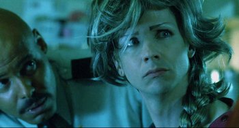 Movie still from “Hedwig and the Angry Inch” (2001), directed by John Cameron Mitchell – A person looking at the camera; Close Up shot, Over the shoulder angle