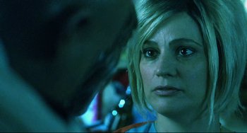 Movie still from “Hedwig and the Angry Inch” (2001), directed by John Cameron Mitchell – A woman's face in front of another woman; Close Up shot, Over the shoulder angle