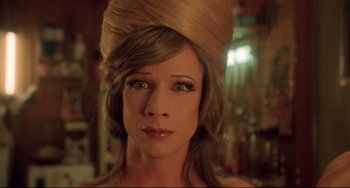 Movie still from “Hedwig and the Angry Inch” (2001), directed by John Cameron Mitchell – A person wearing a hat; Close Up shot, Over the shoulder angle