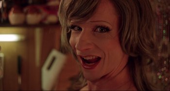 Movie still from “Hedwig and the Angry Inch” (2001), directed by John Cameron Mitchell – A woman's face with green eyes; Close Up shot, High angle