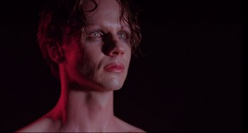 Movie still from “Hedwig and the Angry Inch” (2001), directed by John Cameron Mitchell – A person with wet hair; Close Up shot, Low angle