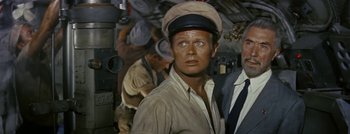 Movie still from “Hell and High Water” (1954), directed by Samuel Fuller – A person wearing a hat; Medium shot, High angle