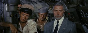 Movie still from “Hell and High Water” (1954), directed by Samuel Fuller – A group of men standing next to each other; Medium shot, High angle