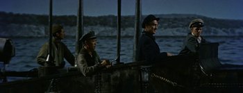 Movie still from “Hell and High Water” (1954), directed by Samuel Fuller – Two men sitting on the side of a boat in the water; Medium shot, High angle