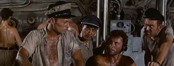 Movie still from “Hell and High Water” (1954), directed by Samuel Fuller – A group of men standing next to each other on a boat; Medium shot, High angle