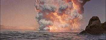 Movie still from “Hell and High Water” (1954), directed by Samuel Fuller – A large cloud of smoke rises above the ocean; Extreme Wide shot, High angle