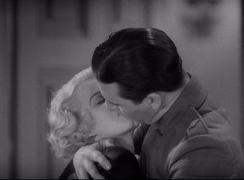 Movie still from “Hell's Angels” (1930), directed by Edmund Goulding – A man and a woman kissing each other; Close Up shot, High angle