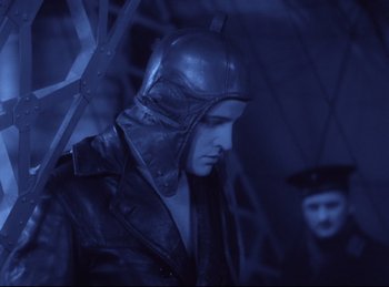 Movie still from “Hell's Angels” (1930), directed by Edmund Goulding – A man in a leather jacket and a helmet; Medium shot, Low angle