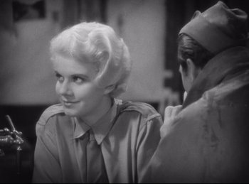 Movie still from “Hell's Angels” (1930), directed by Edmund Goulding – An old photo of a woman sitting in front of another woman; Close Up shot, High angle