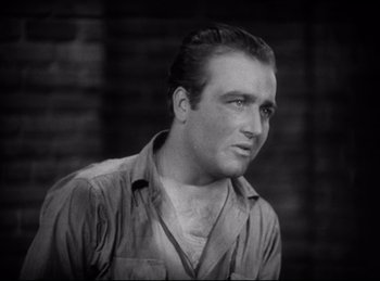 Movie still from “Hell's Angels” (1930), directed by Edmund Goulding – A black - and - white photo of a man with a beard; Close Up shot, Low angle