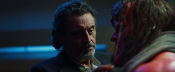 Movie still from “Hellboy” (2019), directed by Neil Marshall – A person with a mask; Close Up shot, Over the shoulder angle