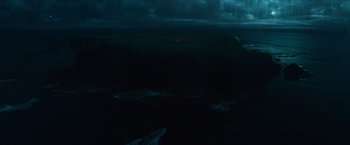 Movie still from “Hellboy” (2019), directed by Neil Marshall – A view of the ocean at night from a plane window; Extreme Wide shot, High angle
