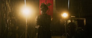 Movie still from “Hellboy” (2019), directed by Neil Marshall – A man in a uniform and a gas mask; Medium shot, Low angle