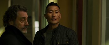 Movie still from “Hellboy” (2019), directed by Neil Marshall – A person wearing a jacket; Close Up shot, Over the shoulder angle