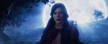 Movie still from “Hellboy” (2019), directed by Neil Marshall – A woman with long black hair wearing a red jacket; Medium shot, Low angle