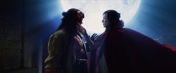 Movie still from “Hellboy” (2019), directed by Neil Marshall – A man and a woman dressed in costumes; Medium shot, Over the shoulder angle