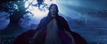 Movie still from “Hellboy” (2019), directed by Neil Marshall – A woman with long black hair wearing a red cape; Medium shot, Low angle
