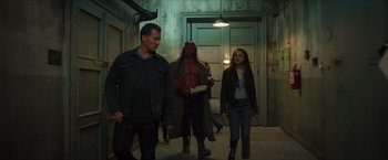 Movie still from “Hellboy” (2019), directed by Neil Marshall – A group of people walking down a hall way; Medium shot, Over the shoulder angle