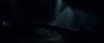 Movie still from “Hellboy” (2019), directed by Neil Marshall – Two people are standing on a bridge in a cave; Extreme Wide shot, High angle