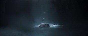 Movie still from “Hellboy” (2019), directed by Neil Marshall – A light post in the middle of a body of water at night; Extreme Wide shot, High angle