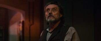 Movie still from “Hellboy” (2019), directed by Neil Marshall – A person wearing a vest; Close Up shot, Low angle