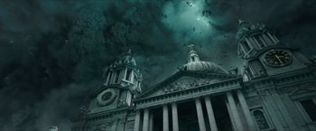 Movie still from “Hellboy” (2019), directed by Neil Marshall – A large building with a clock on the top of it; Extreme Wide shot, Low angle