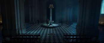 Movie still from “Hellboy” (2019), directed by Neil Marshall – A man standing in front of an altar in a dark room; Extreme Wide shot, High angle