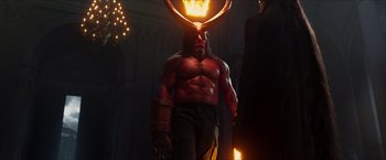 Movie still from “Hellboy” (2019), directed by Neil Marshall – A man with a horned helmet on his head; Medium shot, Over the shoulder angle