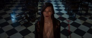 Movie still from “Hellboy” (2019), directed by Neil Marshall – A woman standing in front of a checkerboard floor; Medium shot, High angle