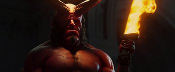 Movie still from “Hellboy” (2019), directed by Neil Marshall – A person wearing a demon mask; Medium shot, Low angle