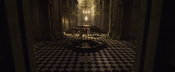Movie still from “Hellboy” (2019), directed by Neil Marshall – Two people are standing in the middle of an empty church; Extreme Wide shot, High angle