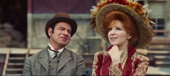 Movie still from “Hello, Dolly!” (1969), directed by Gene Kelly – A man and a woman sitting next to each other; Close Up shot, Over the shoulder angle