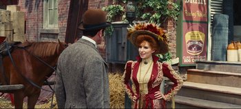 Movie still from “Hello, Dolly!” (1969), directed by Gene Kelly – A man and a woman dressed in period clothing; Medium shot, Over the shoulder angle
