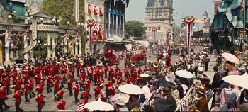 Movie still from “Hello, Dolly!” (1969), directed by Gene Kelly – A crowd of people on a city street with buildings in the background; Extreme Wide shot, High angle