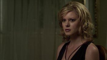 Movie still from “Hellraiser: Revelations” (2011), directed by Víctor Garcia – A woman with blonde hair is looking at the camera; Close Up shot, Over the shoulder angle