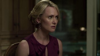 Movie still from “Hellraiser: Revelations” (2011), directed by Víctor Garcia – A woman with blonde hair wearing a purple top; Close Up shot, Over the shoulder angle