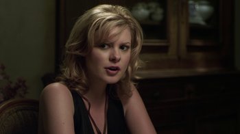 Movie still from “Hellraiser: Revelations” (2011), directed by Víctor Garcia – A woman with blonde hair sitting in front of a mirror; Close Up shot, Over the shoulder angle