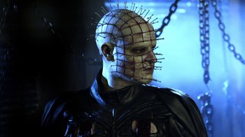 Movie still from “Hellraiser: Revelations” (2011), directed by Víctor Garcia – A person wearing a head piece; Close Up shot, Low angle