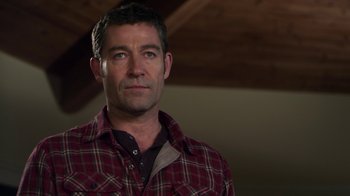 Movie still from “Hellraiser: Revelations” (2011), directed by Víctor Garcia – A person wearing a plaid shirt; Close Up shot, Over the shoulder angle