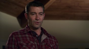 Movie still from “Hellraiser: Revelations” (2011), directed by Víctor Garcia – A person wearing a plaid shirt; Close Up shot, Over the shoulder angle