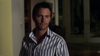 Movie still from “Hellraiser: Revelations” (2011), directed by Víctor Garcia – A person wearing a striped shirt; Close Up shot, Over the shoulder angle