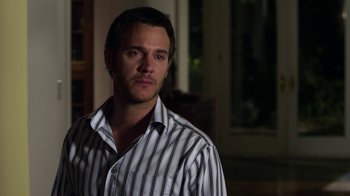 Movie still from “Hellraiser: Revelations” (2011), directed by Víctor Garcia – A person wearing a striped shirt; Close Up shot, Over the shoulder angle