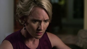 Movie still from “Hellraiser: Revelations” (2011), directed by Víctor Garcia – A person wearing a purple shirt; Close Up shot, Over the shoulder angle