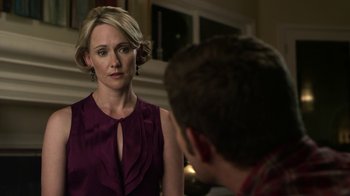 Movie still from “Hellraiser: Revelations” (2011), directed by Víctor Garcia – A woman in a purple dress looking at a man in a red shirt; Close Up shot, Over the shoulder angle